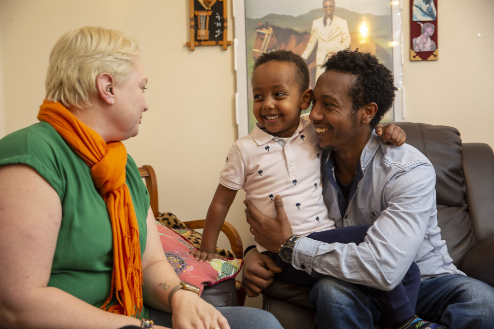 Volunteer working with a family